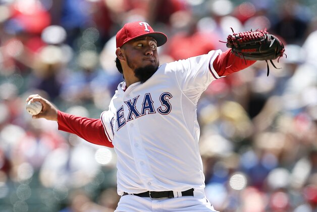 Texas Rangers' Yovani Gallardo works against the San Diego Padres in the first inning of an interleague baseball game, Sunday, July 12, 2015, in Arlington, Texas. (AP Photo/Tony Gutierrez)