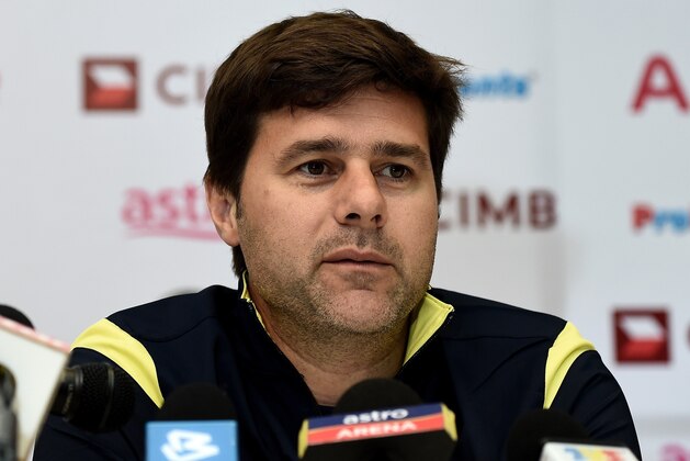Tottenham Hotspur's Argentinian manager and head coach Mauricio Pochettino addresses the media in Kuala Lumpur on May 26, 2015 on the eve of a friendly football match against Malaysia XI. The League Cup finalists will play a Malaysian select team on their first visit to Malaysia since 1979, before facing off against Sydney FC in another friendly match in Sydney.    AFP PHOTO / MANAN VATSYAYANA        (Photo credit should read MANAN VATSYAYANA/AFP/Getty Images)