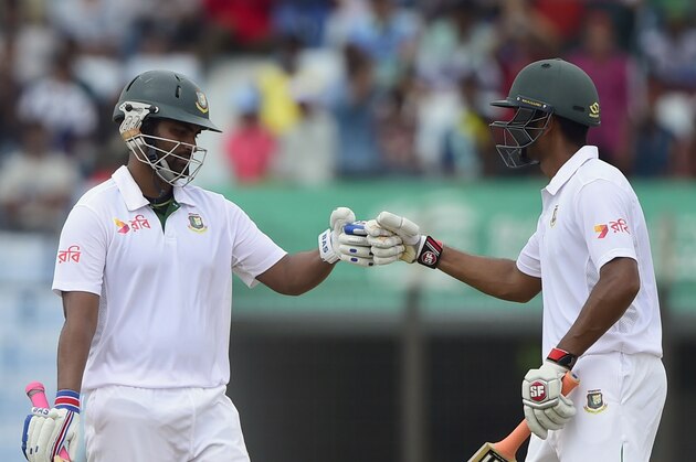 Bangladesh cricketer Tamim Iqbal (L) celebrates his half century (50 runs) with teammate Mohammad Mahmudullah (R) during the second day of the first cricket Test match between Bangladesh and South Africa at the Zahur Ahmed Chowdhury Stadium in Chittagong on July 22, 2015. AFP PHOTO/ Munir uz ZAMAN (Photo credit should read MUNIR UZ ZAMAN/AFP/Getty Images) Bangladesh cricketer Tamim Iqbal (L) celebrates his half century (50 runs) with teammate Mohammad Mahmudullah (R) during the second day of the first cricket Test match between Bangladesh and South Africa at the Zahur Ahmed Chowdhury Stadium in Chittagong on July 22, 2015. AFP PHOTO/ Munir uz ZAMAN (Photo credit should read MUNIR UZ ZAMAN/AFP/Getty Images)