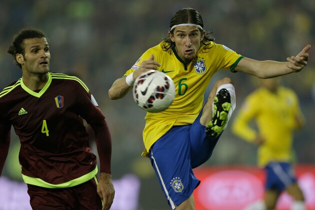 Brazil's Filipe Luis, right, clears a ball beside Venezuela's Oswaldo Vizcarrondo  during a Copa America Group C soccer match at the Monumental stadium in Santiago, Chile, Sunday, June 21, 2015. (AP Photo/Jorge Saenz)