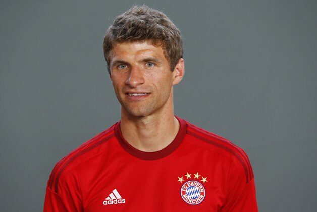 Bayern's Thomas Mueller poses during an official photo shooting for the upcoming German first division Bundesliga soccer season in Munich, Germany, on Thursday, July 16, 2015. (AP Photo/Matthias Schrader)