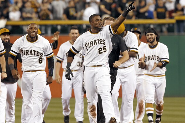 Pittsburgh Pirates' Gregory Polanco (25) points to the stands as he leaves the field while celebrating with teammates after driving in the winning run to defeat the St. Louis Cardinals in the tenth inning of a baseball game, Sunday, July 12, 2015, in Pittsburgh. The Pirates won 6-5 in 10 innings. (AP Photo/Keith Srakocic) Pittsburgh Pirates' Gregory Polanco (25) points to the stands as he leaves the field while celebrating with teammates after driving in the winning run to defeat the St. Louis Cardinals in the tenth inning of a baseball game, Sunday, July 12, 2015, in Pittsburgh. The Pirates won 6-5 in 10 innings. (AP Photo/Keith Srakocic)