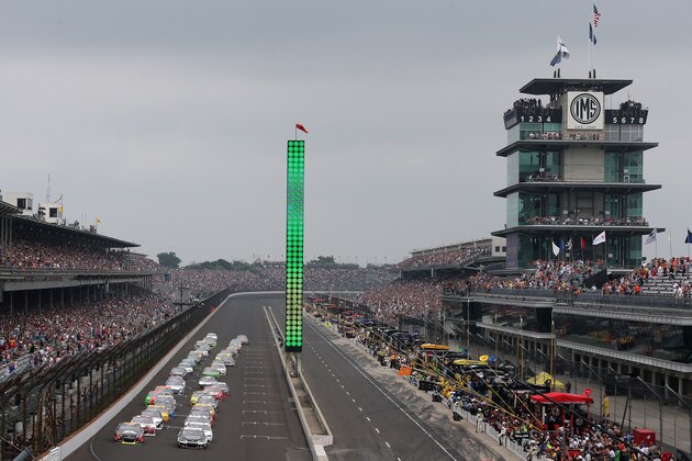 INDIANAPOLIS, IN - JULY 27:  Kevin Harvick, driver of the #4 Jimmy John's Chevrolet, and Jeff Gordon, driver of the #24 Axalta Chevrolet, lead the field to the green flag to start the NASCAR Sprint Cup Series Crown Royal Presents The John Wayne Walding 400 at the Brickyard Indianapolis Motor Speedway on July 27, 2014 in Indianapolis, Indiana.  (Photo by Chris Graythen/Getty Images)