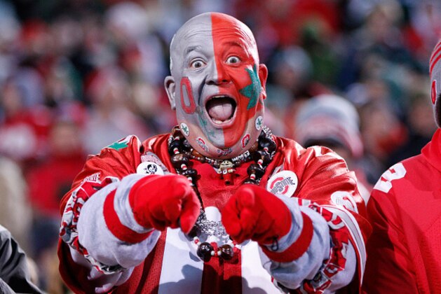 EAST LANSING, MI - NOVEMBER 8: An Ohio State Buckeyes fan gets ready for the game against the Michigan State Spartans at Spartan Stadium on November 8, 2014 in East Lansing, Michigan. (Photo by Joe Robbins/Getty Images)