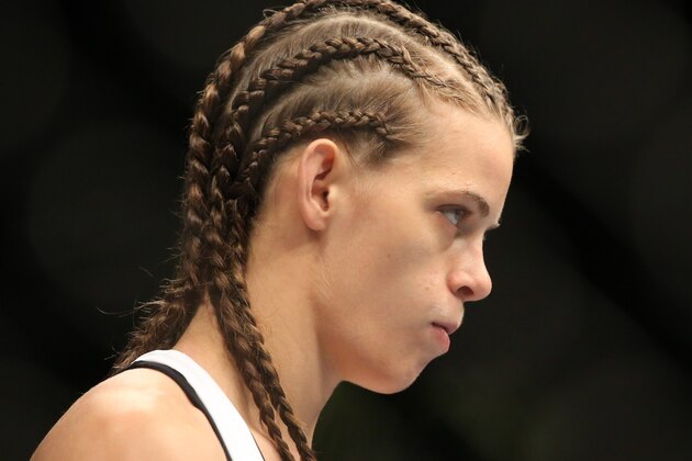 Jul 16, 2014; Atlantic City, NJ, USA; Jessamyn Duke (red gloves) during a women's bantamweight bout against Leslie Smith (not pictured) at Revel Casino. Mandatory Credit: Bill Streicher-USA TODAY Sports