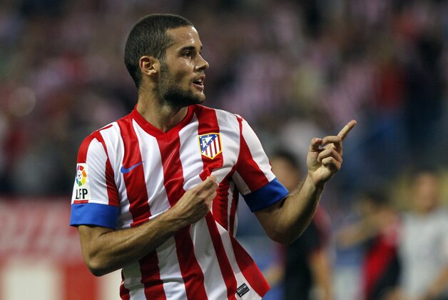 Atletico Madrid's Mario Suarez celebrates his goal during a Spanish La Liga soccer match against Rayo Vallecano at the Vicente Calderon stadium in Madrid, Spain, Sunday, Sept. 16, 2012. (AP Photo/Andres Kudacki)