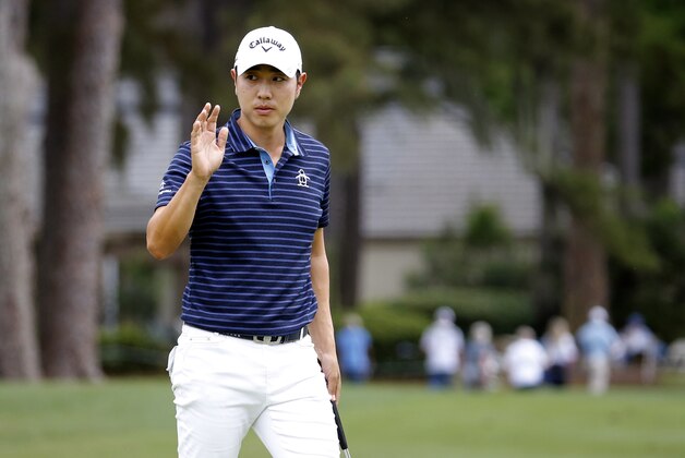 Bae Sang-moon, of South Korea, waves after making a birdie on the ninth hole during the second round of the RBC Heritage golf tournament in Hilton Head Island, S.C., Friday, April 17, 2015. (AP Photo/Stephen B. Morton)