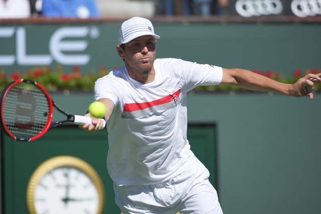 Mardy Fish returns to Ryan Harrison during their match at the BNP Paribas Open tennis tournament, Thursday, March 12, 2015, in Indian Wells, Calif. (AP Photo/Mark J. Terrill)