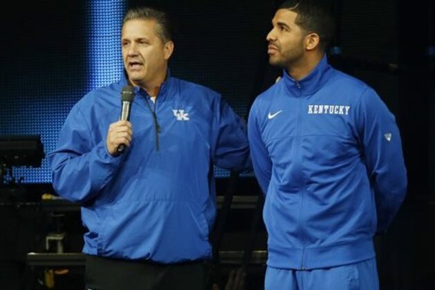 CORRECTS DAY OF WEEK TO FRIDAY - Kentucky coach John Calipari, left, and hip-hop star Drake speak during the team's NCAA college basketball Big Blue Madness, Friday, Oct. 17, 2014, in Lexington, Ky. (AP Photo/James Crisp)