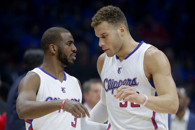 Los Angeles Clippers forward Blake Griffin, right, talks with guard Chris Paul during the first half of Game 6 in a second-round NBA basketball playoff series against the Houston Rockets in Los Angeles, Thursday, May 14, 2015. (AP Photo/Jae C. Hong)