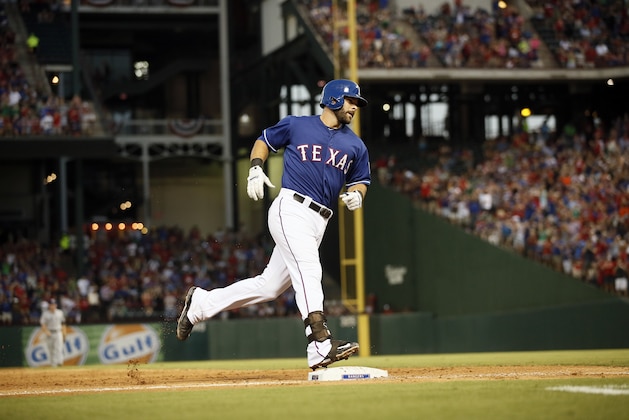 Texas Rangers' Mitch Moreland rounds third after hitting a solo home run against the San Diego Padres in an interleague baseball game Saturday, July 11, 2015, in Arlington, Texas. (AP Photo/Tony Gutierrez)