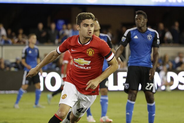 Manchester United midfielder Andreas Pereira, left, reacts after scoring a goal as San Jose Earthquakes midfielder Fatai Alashe, right, watches during the second half of an International Champions Cup soccer match Tuesday, July 21, 2015, in San Jose, Calif. Manchester United won 3-1. (AP Photo/Eric Risberg)