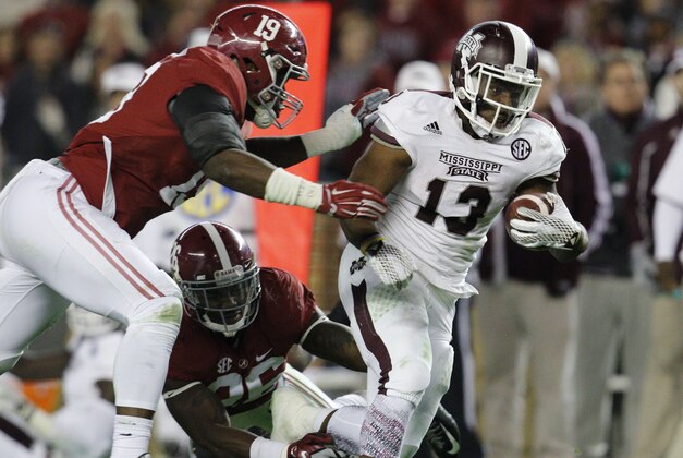 Nov 15, 2014; Tuscaloosa, AL, USA; Mississippi State Bulldogs running back Josh Robinson (13) carries the ball past Alabama Crimson Tide linebacker Reggie Ragland (19) and Landon Collins (26) in the third quarter at Bryant-Denny Stadium. Mandatory Credit: Marvin Gentry-USA TODAY Sports