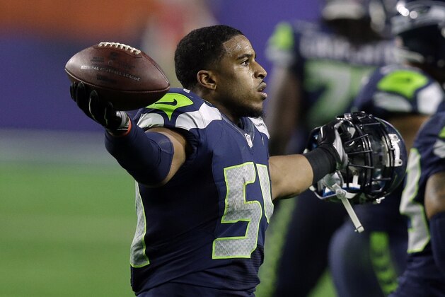 Seattle Seahawks middle linebacker Bobby Wagner (54) reacts after a play during the second half of NFL Super Bowl XLIX football game against the New England Patriots on Sunday, Feb. 1, 2015, in Glendale, Ariz. (AP Photo/Brynn Anderson)