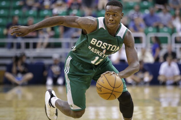 Boston Celtics' Terry Rozier (12) drives against the San Antonio Spurs during the second half of an NBA summer league basketball game Thursday, July 9, 2015, in Salt Lake City. (AP Photo/Rick Bowmer)
