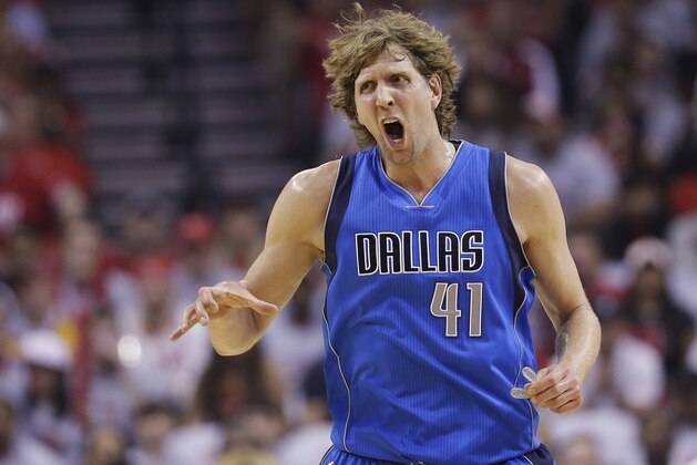 Dallas Mavericks' Dirk Nowitzki (41) reacts during the first half of Game 2 in an NBA basketball first-round playoff series against the Houston Rockets, Tuesday, April 21, 2015, in Houston. (AP Photo/David J. Phillip)