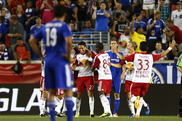 New York Red Bulls midfielder Sean Davis (27) is congratulated by teammates after scoring the first of his two goals in the second half as Chelsea FC forward Diego Costa (19) watches during a soccer match in the International Champions Cup in Harrison N.J., Wednesday, July 22, 2015. The Red Bulls defeated Chelsea 4-2. (AP Photo/Rich Schultz) New York Red Bulls midfielder Sean Davis (27) is congratulated by teammates after scoring the first of his two goals in the second half as Chelsea FC forward Diego Costa (19) watches during a soccer match in the International Champions Cup in Harrison N.J., Wednesday, July 22, 2015. The Red Bulls defeated Chelsea 4-2. (AP Photo/Rich Schultz)