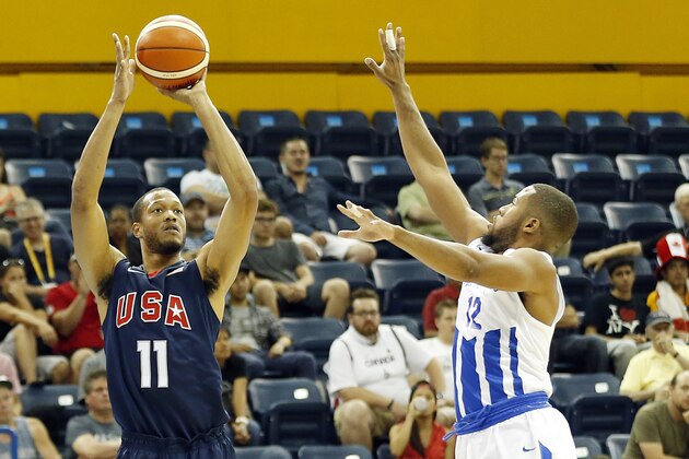 Jul 22, 2015; Toronto, Ontario, CAN; United States forward Damien Wilkins (12) shoots the ball against Puerto Rico guard Gary Browne (12) in the men's basketball preliminary round during the 2015 Pan Am Games at Ryerson Athletic Centre. Mandatory Credit: Geoff Burke-USA TODAY Sports