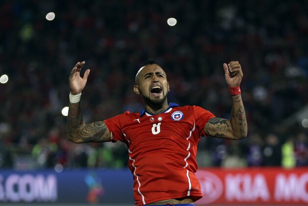 Chile's Arturo Vidal celebrates after scoring a penalty during penalty shootout at the Copa America final soccer match against Argentina at the National Stadium in Santiago, Chile, Saturday, July 4, 2015. Chile won the Copa America on penalty shootout.(AP Photo/Natacha Pisarenko)