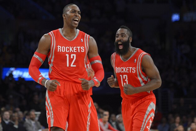 Houston Rockets center Dwight Howard, left, and guard James Harden reacts after Howard was called for a technical foul during the first half of an NBA basketball game against the Los Angeles Lakers, Wednesday, Feb. 19, 2014, in Los Angeles. (AP Photo/Mark J. Terrill)