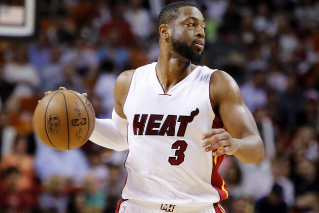 Miami Heat guard Dwyane Wade takes the ball downcourt in the first half against the Detroit Pistons in an NBA basketball game, Sunday, March 29, 2015, in Miami. Miami won 109-102 with Wade scoring 40 points.  (AP Photo/Joe Skipper)