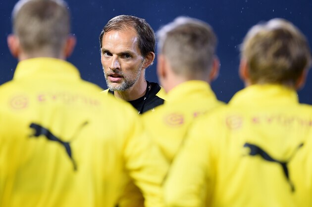 New head coach of Germany's football club Borussia Dortmund Thomas Tuchel (2nd-L) speaks to team members during a training session after their arrival in Japan in Kawasaki, suburb of Tokyo on July 6, 2015.  Borussia Dortmund will play a friendly match with Japan's club Kawasaki Frontale on July 7.     AFP PHOTO / Toru YAMANAKA        (Photo credit should read TORU YAMANAKA/AFP/Getty Images)