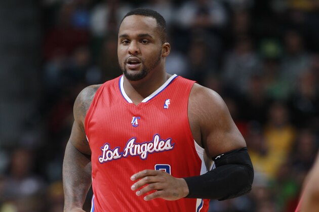 Los Angeles Clippers center Glen Davis runs court agianst the Denver Nuggets in the third quarter of the Nuggets' 110-100 victory in an NBA basketball game in Denver on Monday, March 17, 2014. (AP Photo/David Zalubowski)