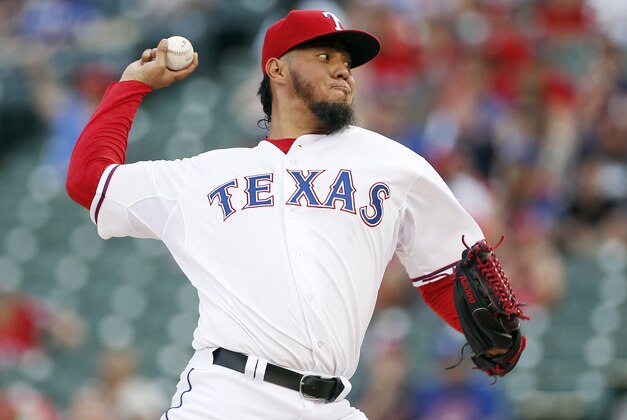 Texas Rangers starting pitcher Yovani Gallardo (49) throws during the first inning of a baseball game against the Boston Red Sox, Friday, May 29, 2015, in Arlington, Texas. (AP Photo/Brandon Wade)