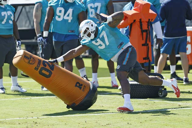 DAVIE, FL - MAY 8: Jordan Phillips #97 of the Miami Dolphins runs a drill during the rookie minicamp on May 8, 2015 at the Miami Dolphins training facility in Davie, Florida. Phillips was the Dolphins second round draft pick. (Photo by Joel Auerbach/Getty Images) DAVIE, FL - MAY 8: Jordan Phillips #97 of the Miami Dolphins runs a drill during the rookie minicamp on May 8, 2015 at the Miami Dolphins training facility in Davie, Florida. Phillips was the Dolphins second round draft pick. (Photo by Joel Auerbach/Getty Images)