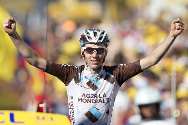 Romain Bardet of France celebrates as he crosses the finish line to win the seventeenth stage of the Tour de France cycling race over 161 kilometers (100 miles) with start in Digne-les-Bains and finish in Pra Loup, France, Thursday, July 23, 2015. (AP Photo/Peter Dejong)