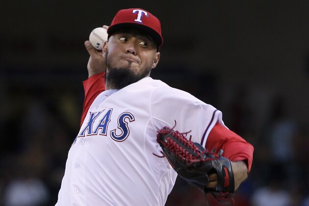Texas Rangers starting pitcher Yovani Gallardo throws during the first inning of a baseball game against the Los Angeles Dodgers in Arlington, Texas, Monday, June 15, 2015. (AP Photo/LM Otero)