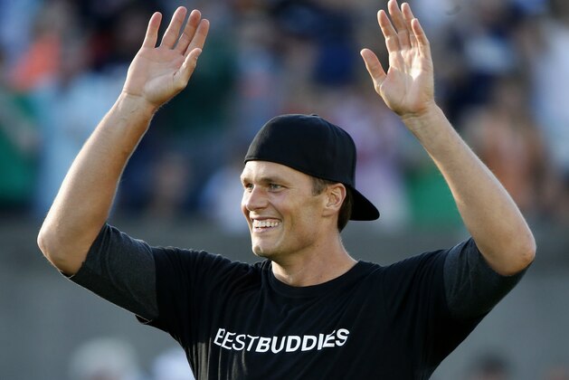 New England Patriots' Tom Brady reacts while playing in the Best Buddies Challenge charity football game in Boston, Friday, May 29, 2015. (AP Photo/Michael Dwyer)