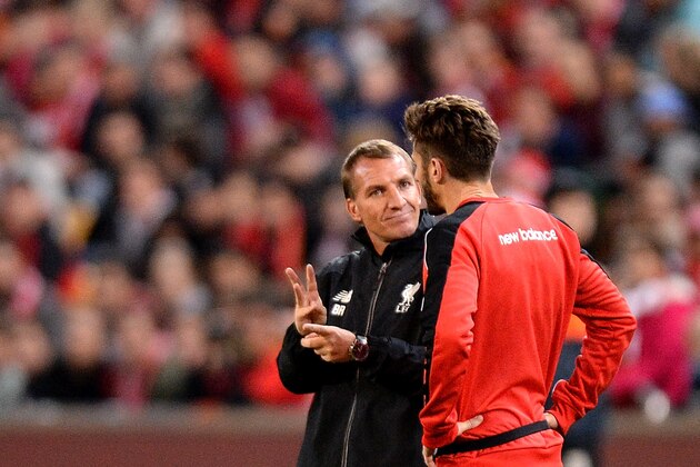BRISBANE, AUSTRALIA - JULY 16: Manager Brendan Rodgers talks tactics with Adam Lallana during a Liverpool FC training session at Suncorp Stadium on July 16, 2015 in Brisbane, Australia.  (Photo by Bradley Kanaris/Getty Images)