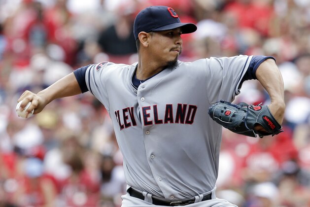 Cleveland Indians starting pitcher Carlos Carrasco throws in the second inning of a baseball game against the Cincinnati Reds, Sunday, July 19, 2015, in Cincinnati. (AP Photo/John Minchillo)