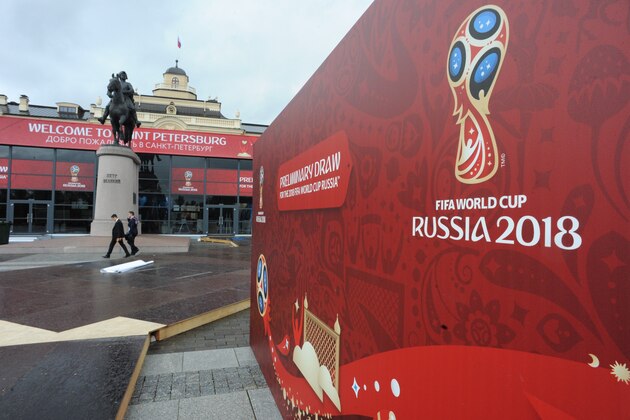 Men walk along a hall close to the Constantine (Konstantinovsky) Palace in St. Petersburg on July 22, 2015, where the Preliminary draw for the 2018 FIFA World Cup will be held on July 25. AFP PHOTO / OLGA MALTSEVA        (Photo credit should read OLGA MALTSEVA/AFP/Getty Images)