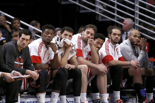 The core of the Chicago Bulls sit on the bench during the closing minutes of their 97-77 loss to the Utah Jazz during the second half of an NBA basketball game Wednesday, Jan. 7, 2015, in Chicago. From left are Kirk Hinrich, Jimmy Butler, Nikola Mirotic, Pau Gasol, Derrick Rose, Joakim Noah, Taj Gibson.  (AP Photo/Charles Rex Arbogast)