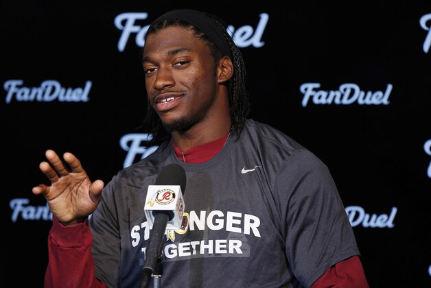 May 26, 2015; Ashbury, VA, USA; Washington Redskins quarterback Robert Griffin III speaks with the media at the conclusion of the Redskins OTA at Redskins Park. Mandatory Credit: Geoff Burke-USA TODAY Sports