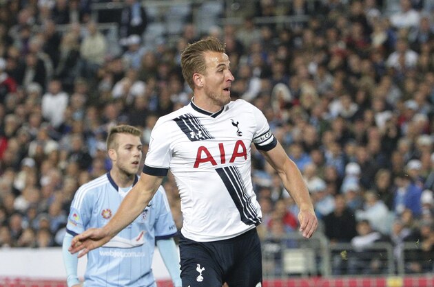 Tottenham Hotspur player Harry Kane, top, runs over Sydney F.C. player Peter Triantis during their friendly match against Sydney F.C. in Sydney, Australia, Saturday, May 30, 2015. (AP Photo/Rob Griffith)