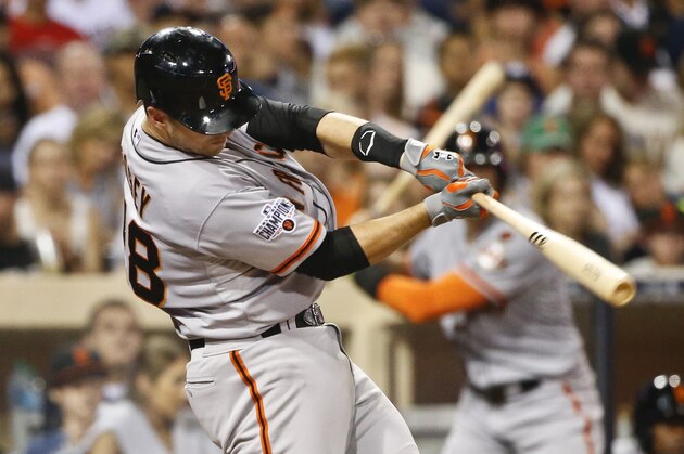 San Francisco Giants' Buster Posey singles to left field against the San Diego Padres in the fifth inning of a baseball game, Monday, July 20, 2015, in San Diego. (AP Photo/Lenny Ignelzi)