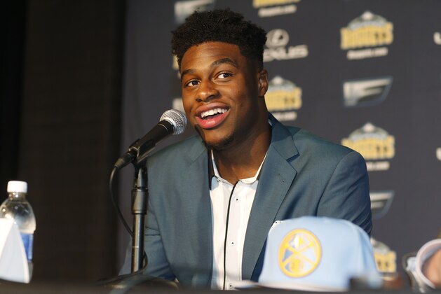Emmanuel Mudiay is introduced after being selected as the seventh overall pick in the NBA Draft by the Denver Nuggets Friday, June 26, 2015. (AP Photo/David Zalubowski)