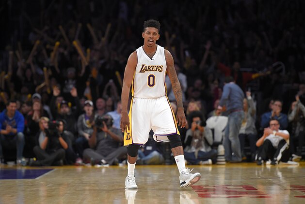 Los Angeles Lakers forward Nick Young looks on after scoring during the second half of an NBA basketball game against the Indiana Pacers, Sunday, Jan. 4, 2015, in Los Angeles.  The Lakers won 88-87. (AP Photo/Mark J. Terrill)