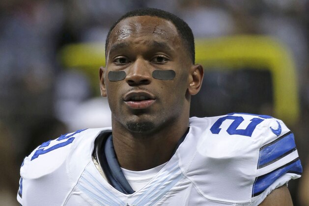 FILE - In this Nov. 10, 2013, file photo, Dallas Cowboys running back Joseph Randle (21) warms up before an NFL football game against the New Orleans Saints in New Orleans. Early into 2015, there have been more than a half-dozen players arrested, a star suspended, an agent indicted, and a popular player entering rehab. In Kansas, police are investigating a domestic abuse claim against Randle made by an ex-girlfriend a day after his arrest at a Kansas hotel on a drug charge that's been dropped. The probe continues. (AP Photo/Dave Martin, File)
