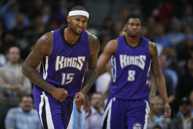 Sacramento Kings center DeMarcus Cousins, fornt, and forward Rudy Gay run the court against the Denver Nuggets in the fourth quarter of the Kings' 110-105 victory in an NBA basketball game in Denver on Monday, Nov. 3, 2014. (AP Photo/David Zalubowski)