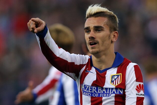 Antoine Griezmann from France points during a Spanish La Liga soccer match between Atletico de Madrid and Real Sociedad at the Vicente Calderon stadium in Madrid, Spain, Tuesday, April 7, 2015. (AP Photo/Daniel Ochoa de Olza)
