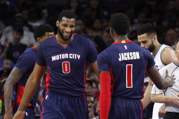 Apr 12, 2015; Auburn Hills, MI, USA; Detroit Pistons center Andre Drummond (0) celebrates with guard Reggie Jackson (1) after scoring during the first quarter against the Charlotte Hornets at The Palace of Auburn Hills. Mandatory Credit: Raj Mehta-USA TODAY Sports