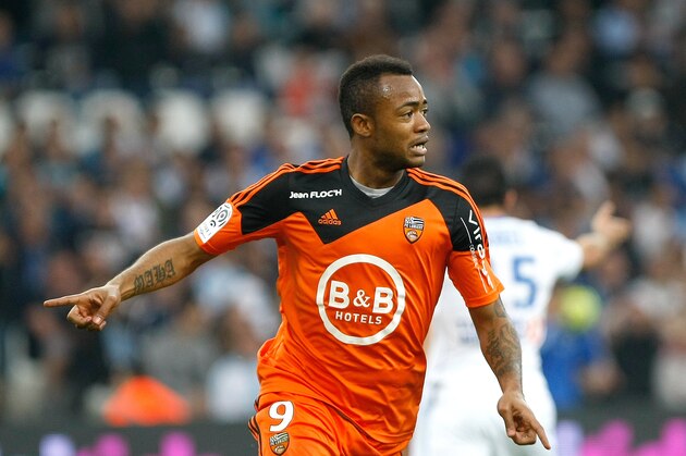 Lorient's forward Jordan Ayew celebrates  after scoring against Marseille , during the League One soccer match between Marseille and Lorient, at the Velodrome Stadium, in Marseille, southern France, Friday, April 24, 2015. (AP Photo/Claude Paris)