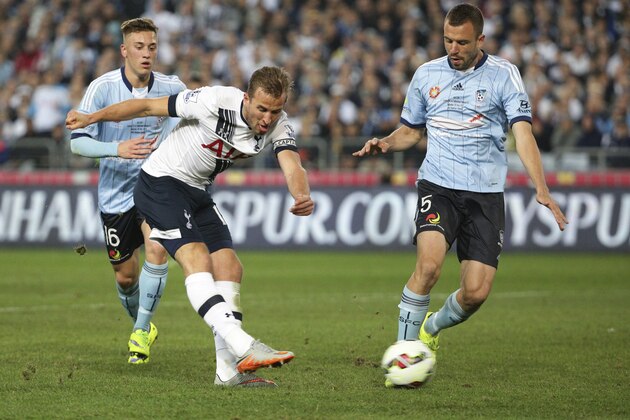 Tottenham Hotspur player Harry Kane, center, kicks for a goal during their friendly match against Sydney F.C. in Sydney, Australia, Saturday, May 30, 2015. (AP Photo/Rob Griffith)