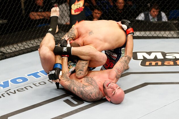 TULSA, OK - AUGUST 23:  (R-L) Ben Saunders controls the body of Chris Heatherly in their welterweight fight during the UFC Fight Night event at the BOK Center on August 23, 2014 in Tulsa, Oklahoma. (Photo by Josh Hedges/Zuffa LLC/Zuffa LLC via Getty Images)