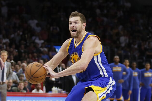 Golden State Warriors' David Lee passes the ball against the Los Angeles Clippers during the second half of an NBA basketball game, Tuesday, March 31, 2015, in Los Angeles. The Warriors won 110-106. (AP Photo/Danny Moloshok)