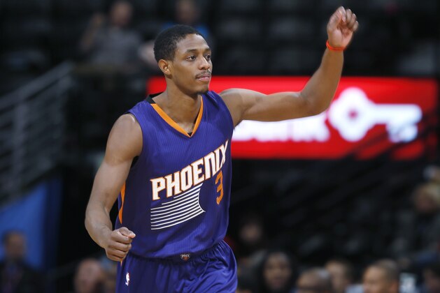 Phoenix Suns guard Brandon Knight reacts after hitting a 3-point basket against the Denver Nuggets late in the fourth quarter of an NBA basketball game Wednesday, Feb. 25, 2015, in Denver. The Suns won 110-96. (AP Photo/David Zalubowski)